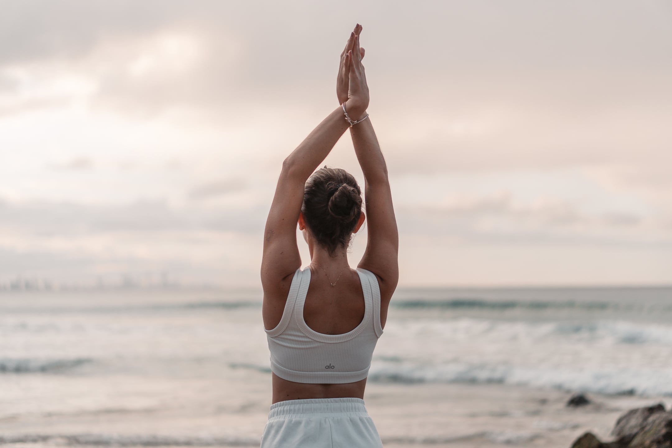Tarryn practicing yoga in white Bali villa