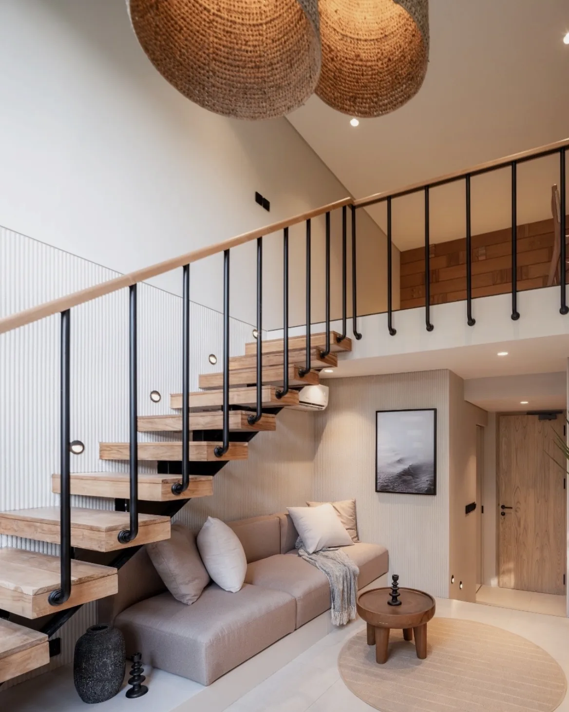 The loft, with its stair up to the mezzanine bedroom