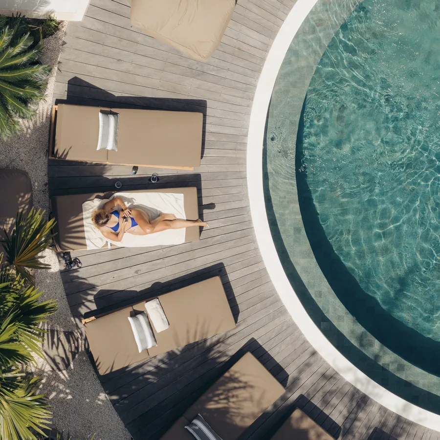 Daybeds around the pool seen from above