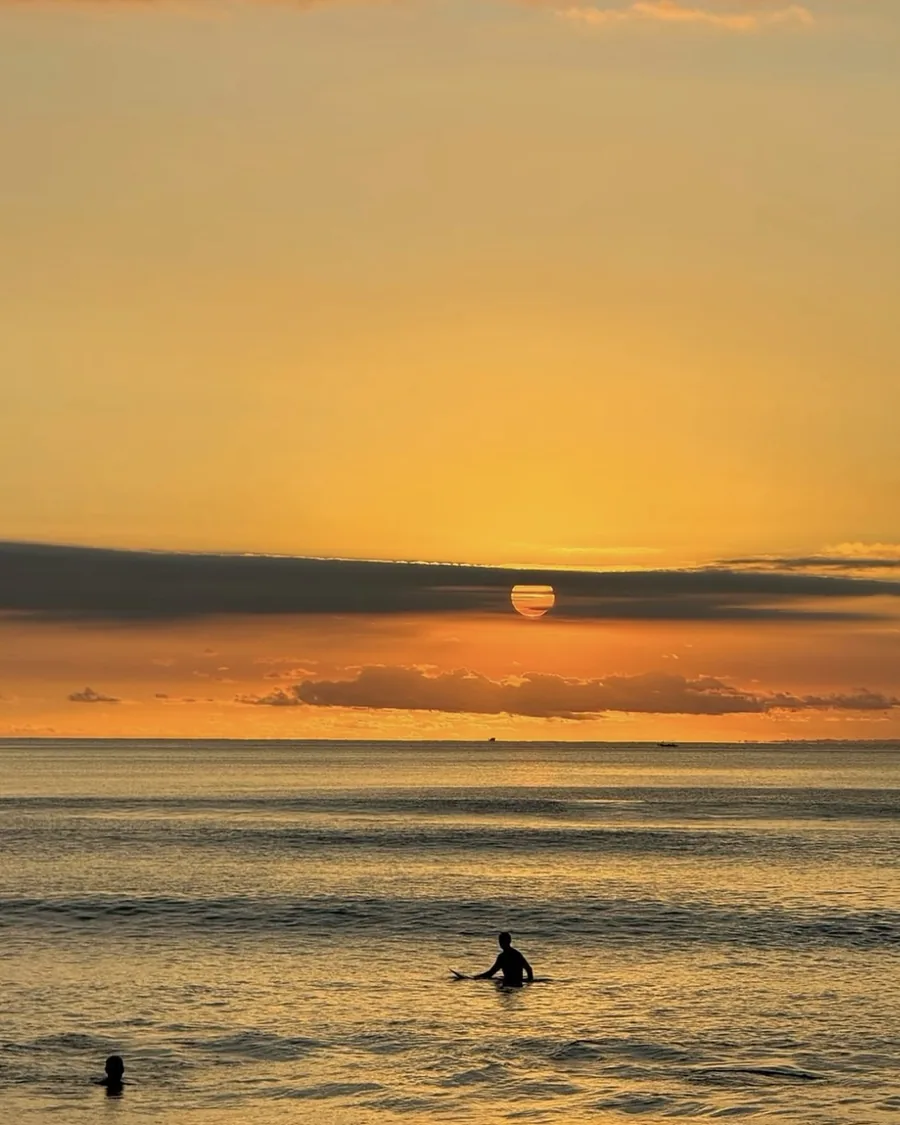 The sun dropping into the ocean at the end of the day
