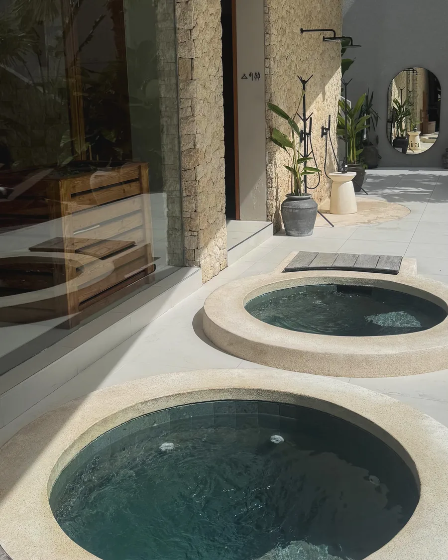 The ice baths and sauna in the limestone courtyard